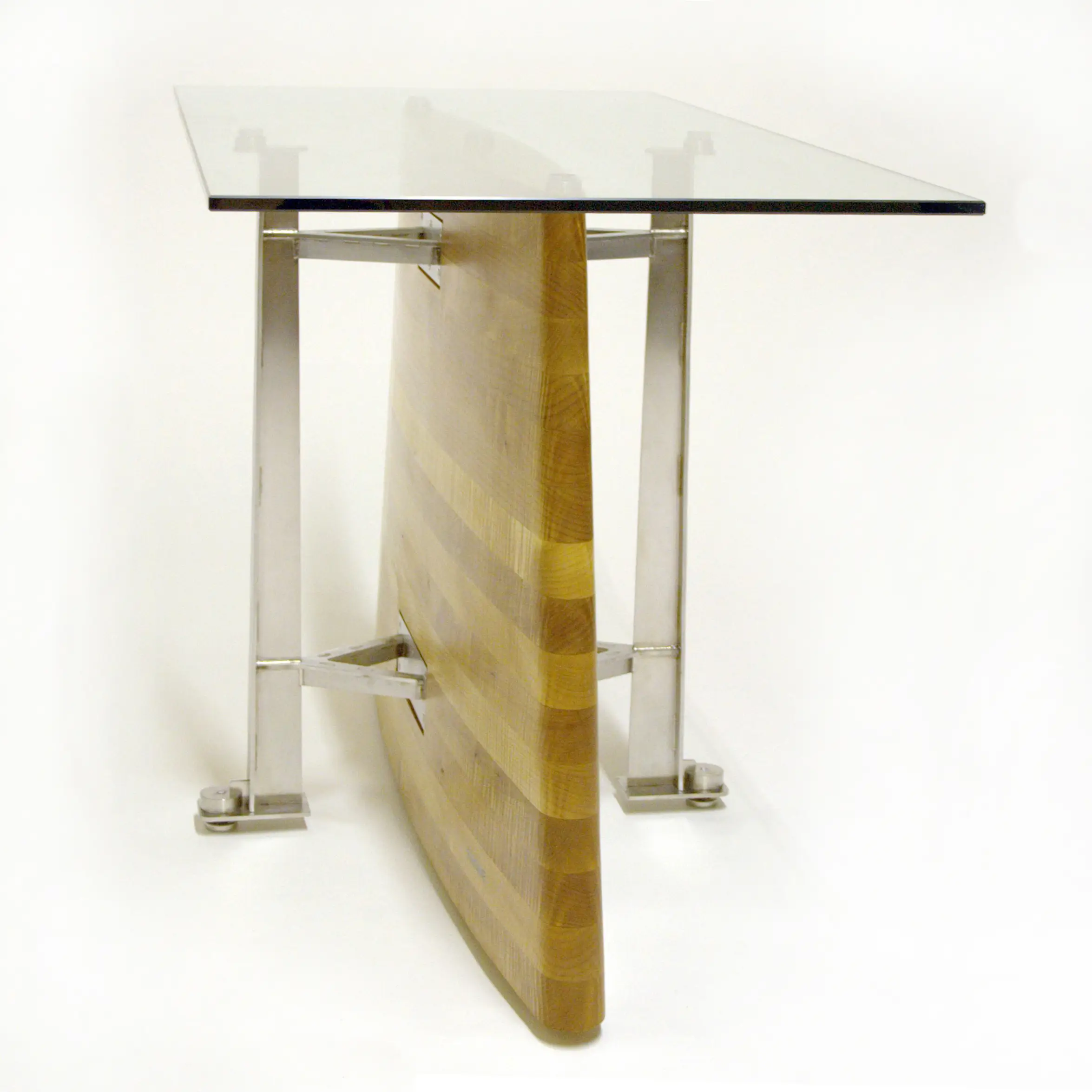 Side view of the Erosion Table showing its wooden central structure beneath a glass tabletop