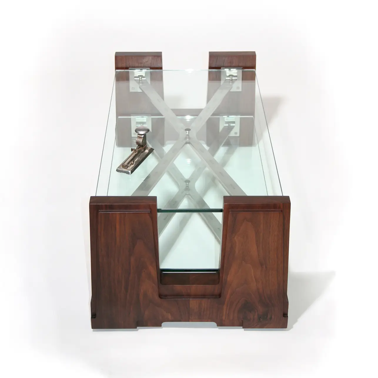 Detail of the Extension Table highlighting the relationship between transparent glass and precision-engineered supports.