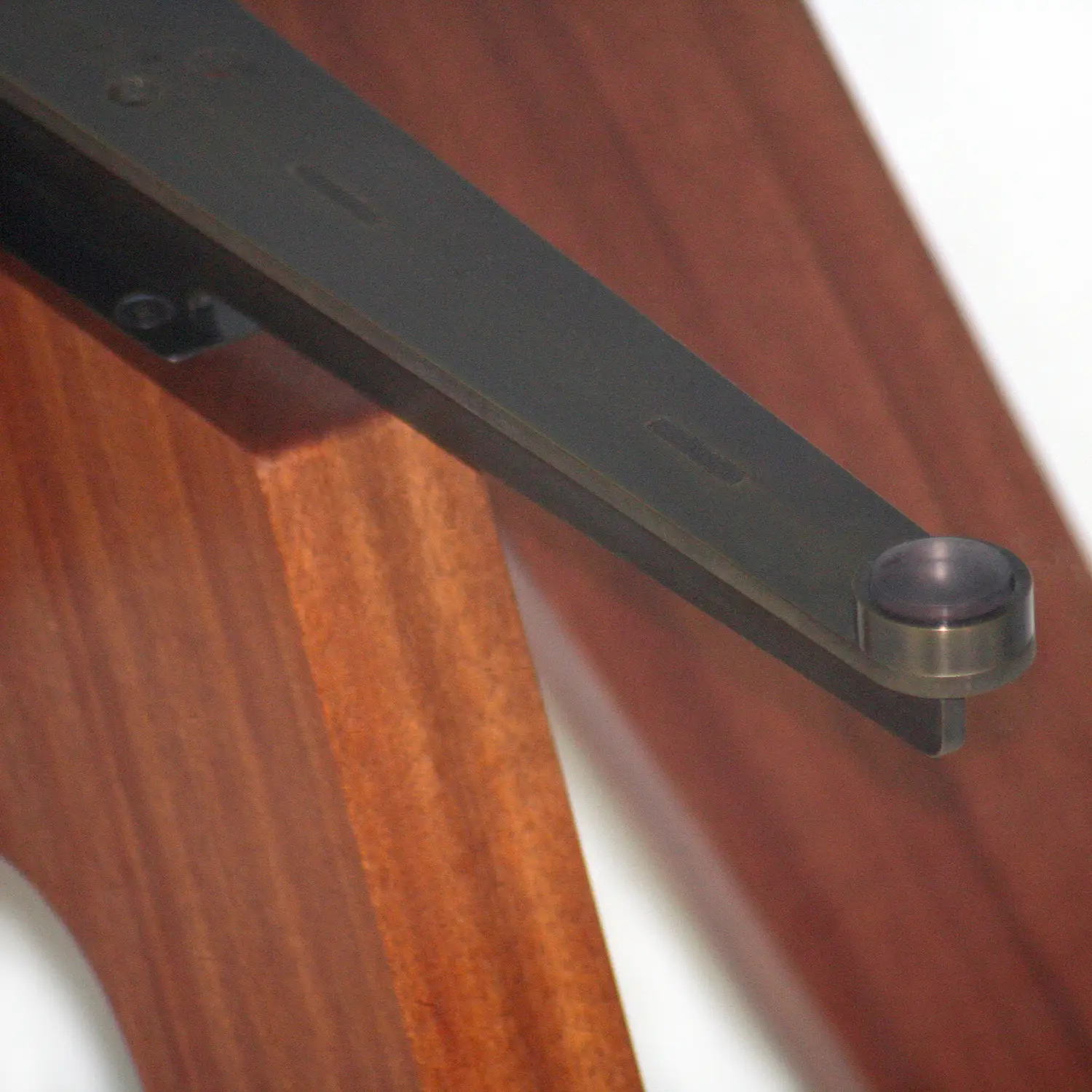 Detail of the Float Table highlighting the structural connections beneath its transparent glass top.