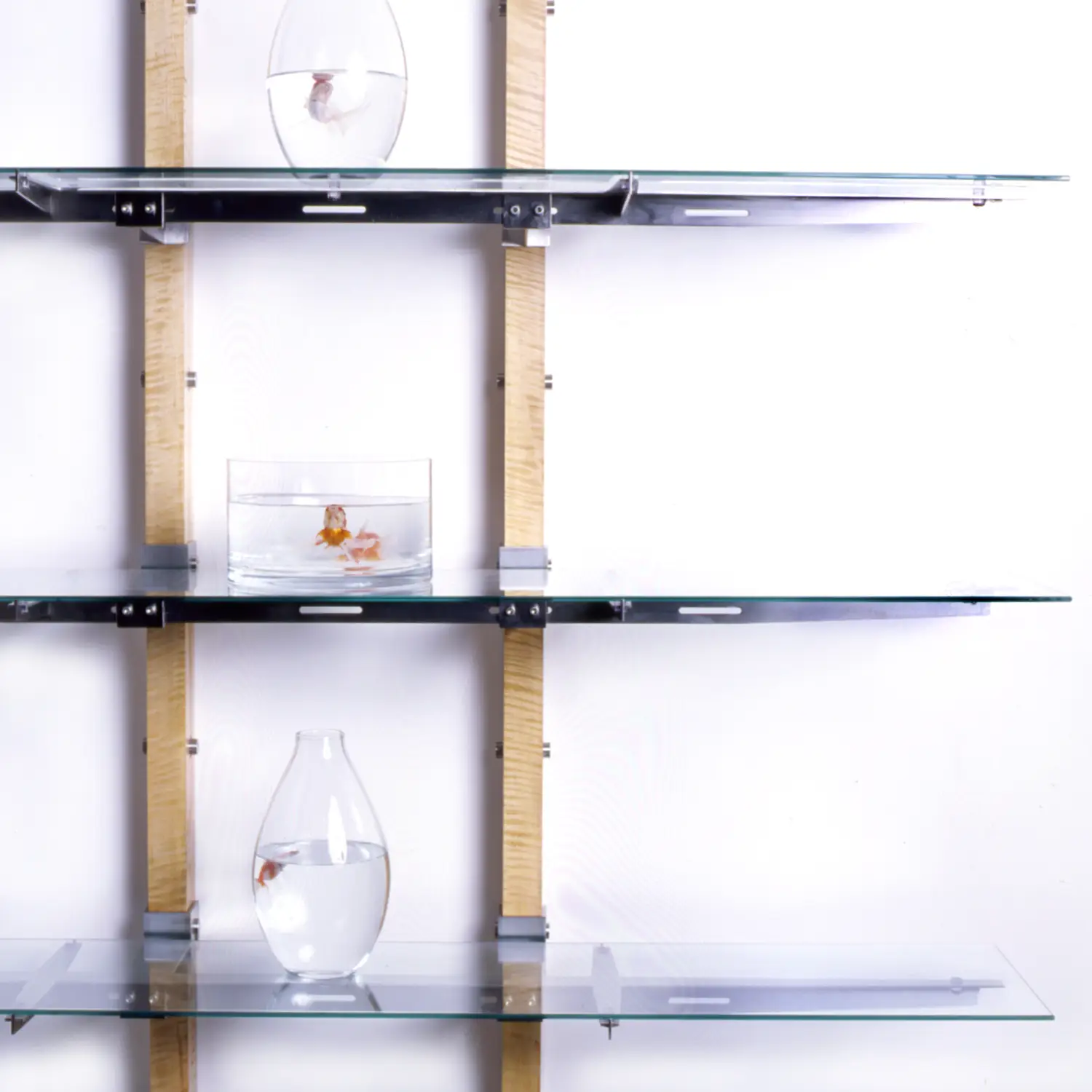 Grace Shelf showing the arrangement of glass shelves suspended from vertical wooden supports