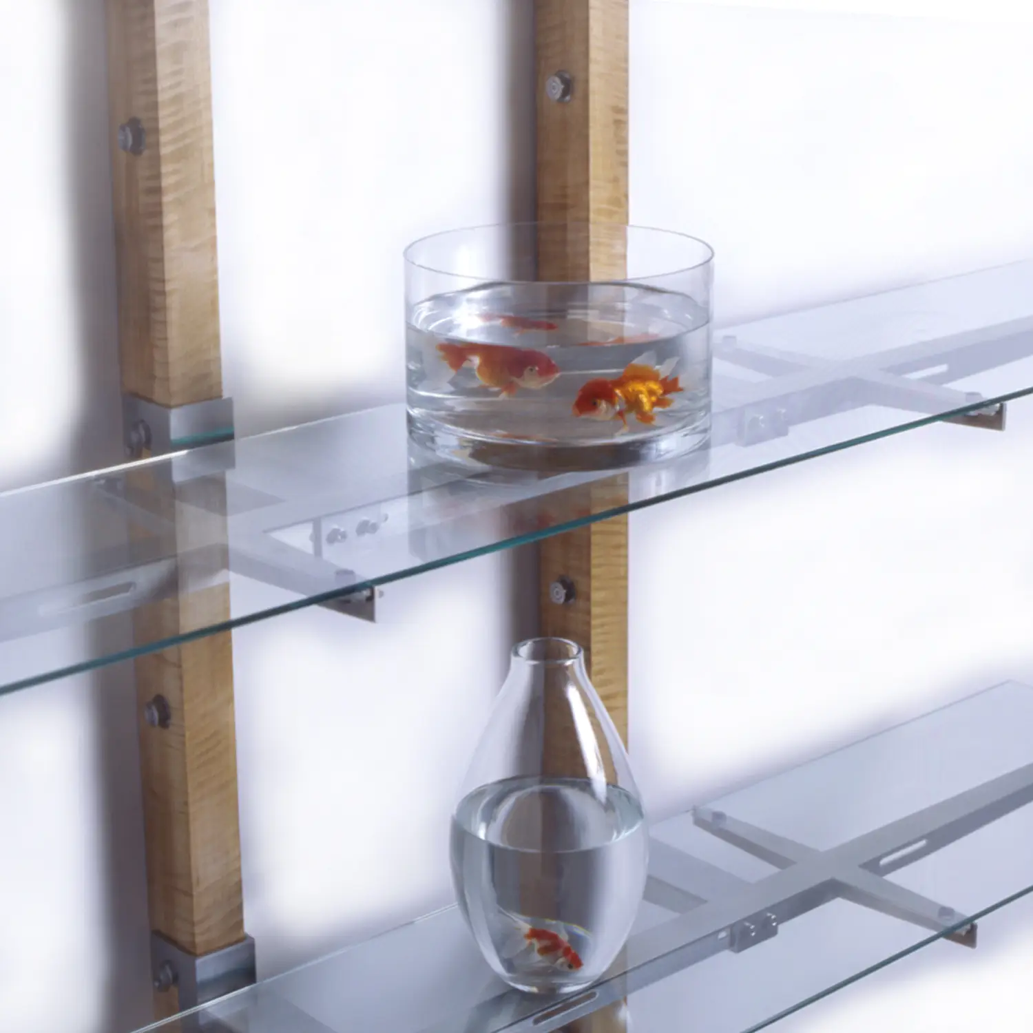 Grace Shelf architectural shelving design with transparent glass shelves and exposed metal brackets