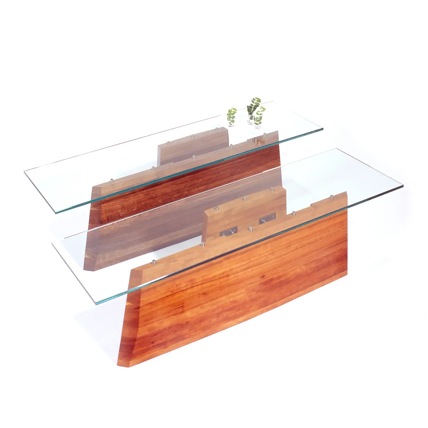 Hansen Table displaying its refined wooden construction and gently flowing architectural lines.