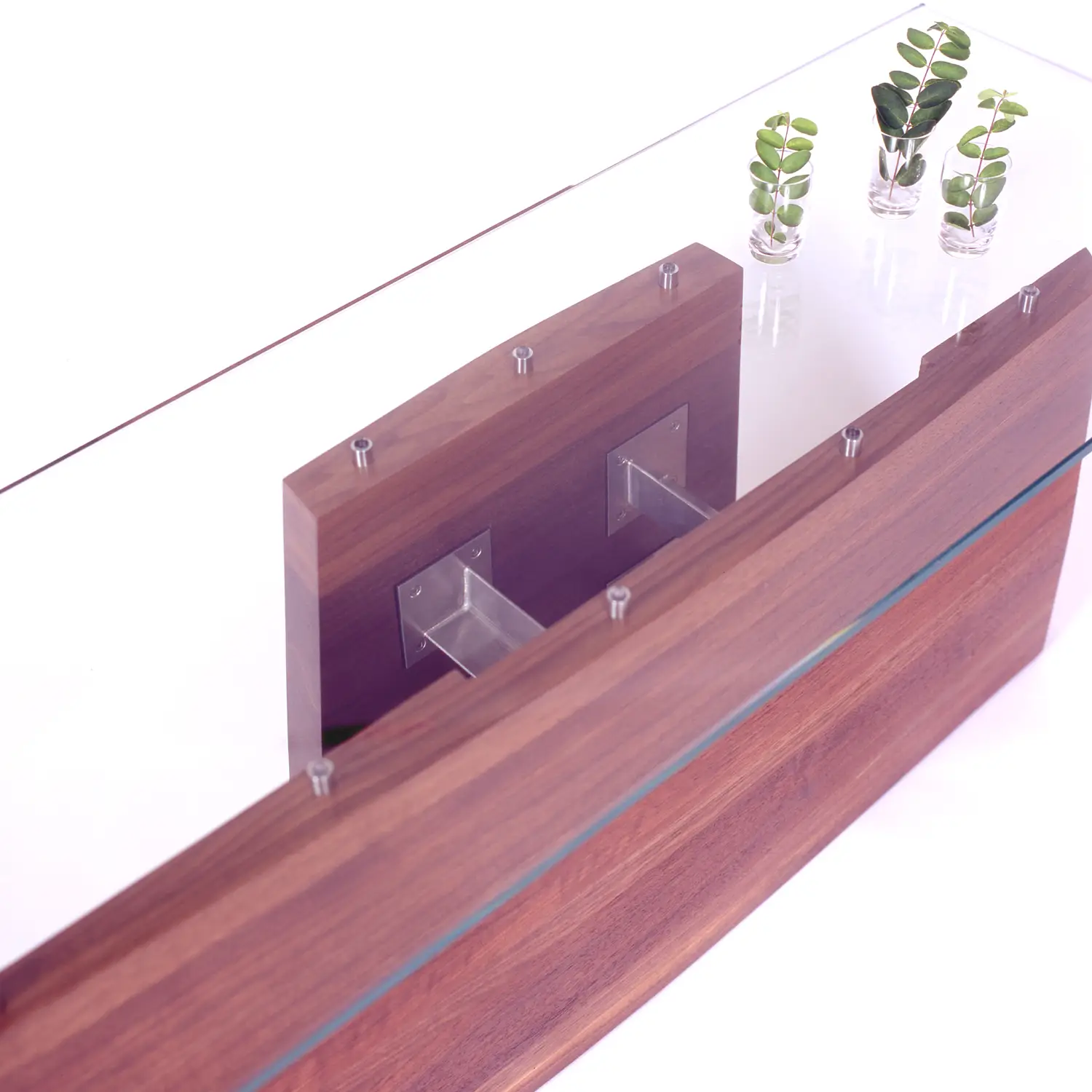 Hansen Table featuring an organically curved wooden form inspired by the contours of the human hand.