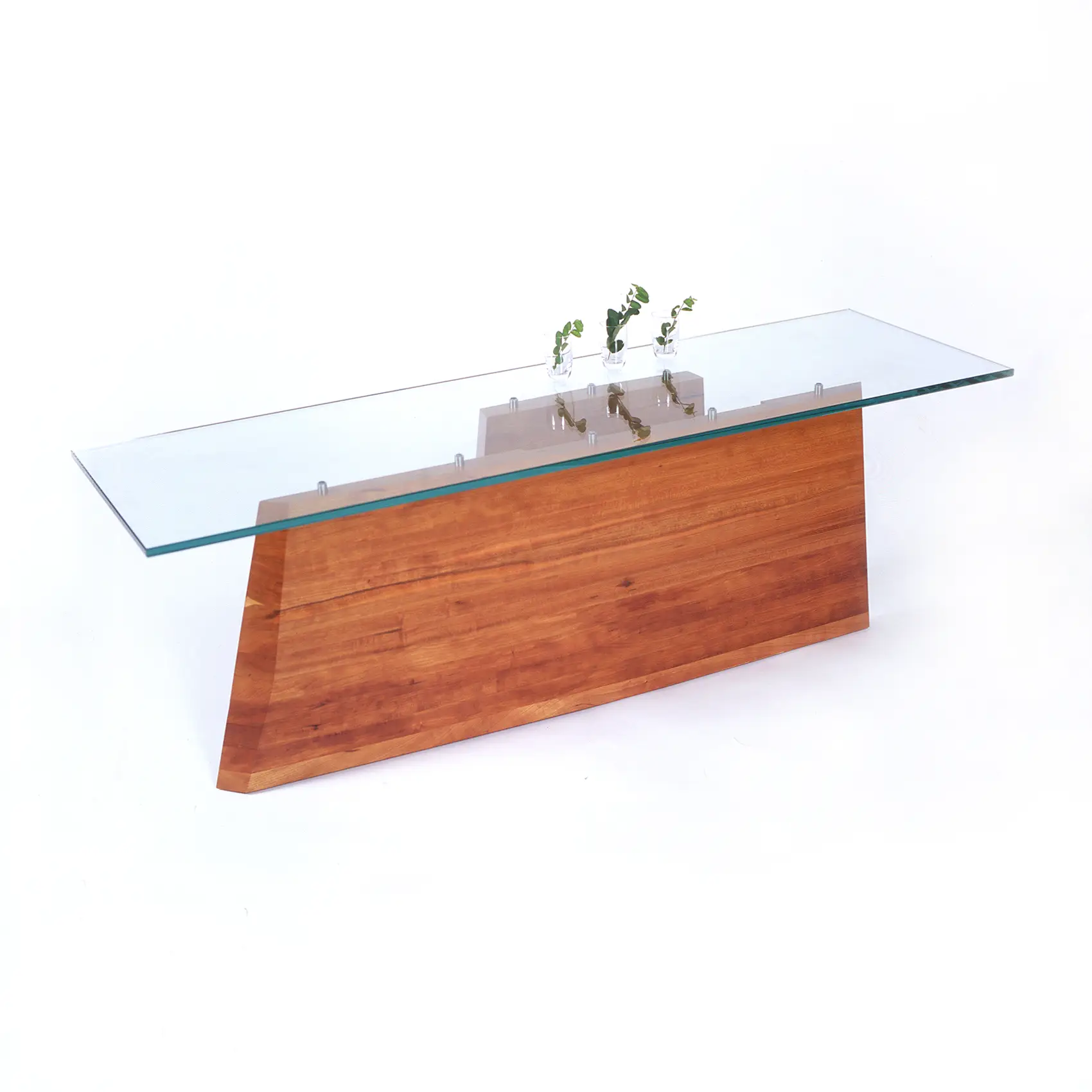 Side profile of the Hansen Table showing its smooth curves and carefully balanced proportions.