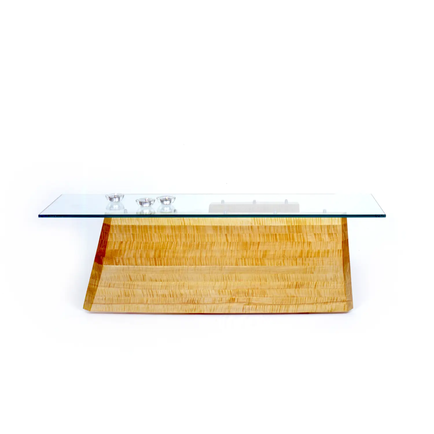 Close-up of the Hansen Table emphasizing the craftsmanship and contours of its wooden surface.