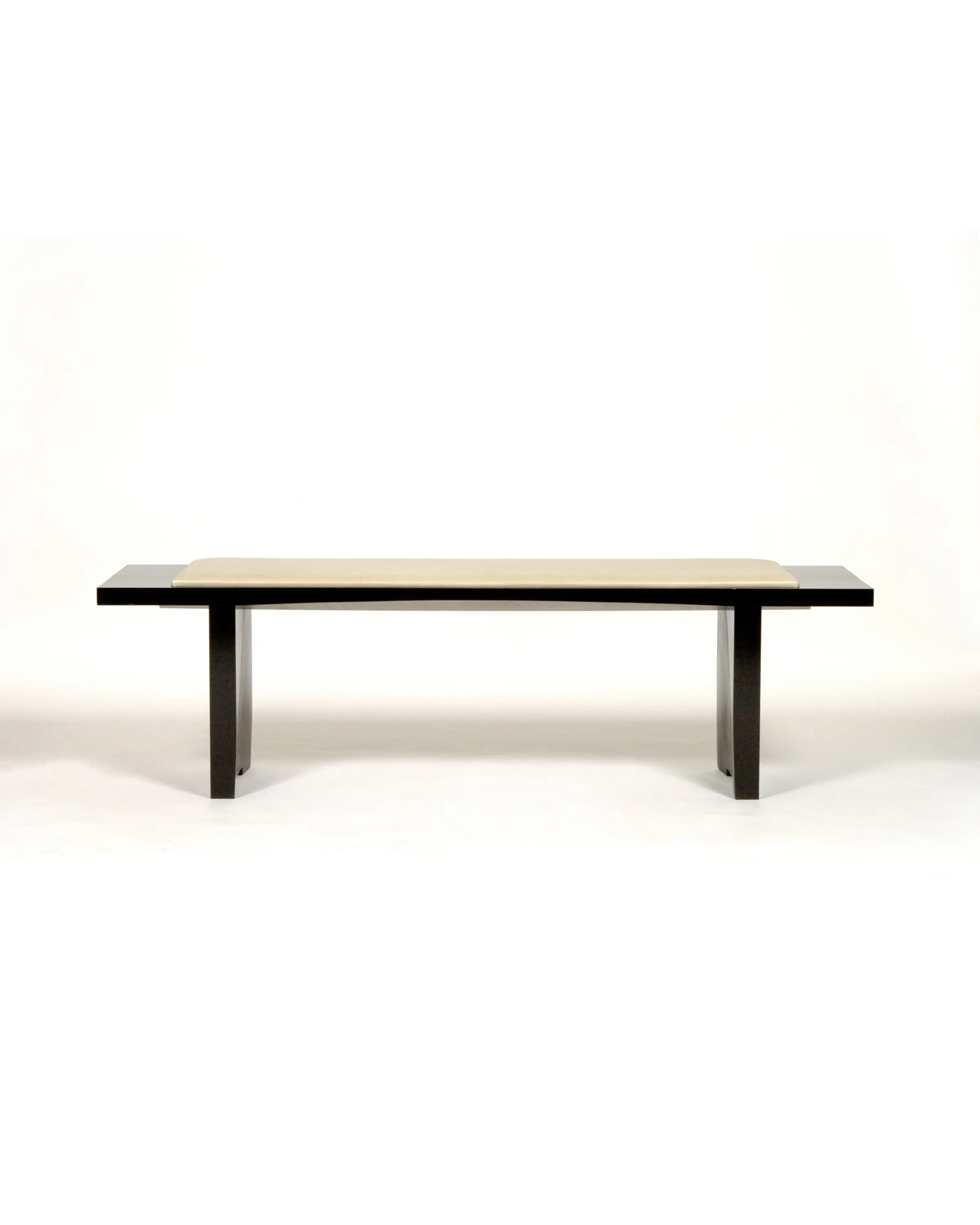 Hisashiburi Bench with dark wooden frame and light-colored upholstered seat viewed from the front