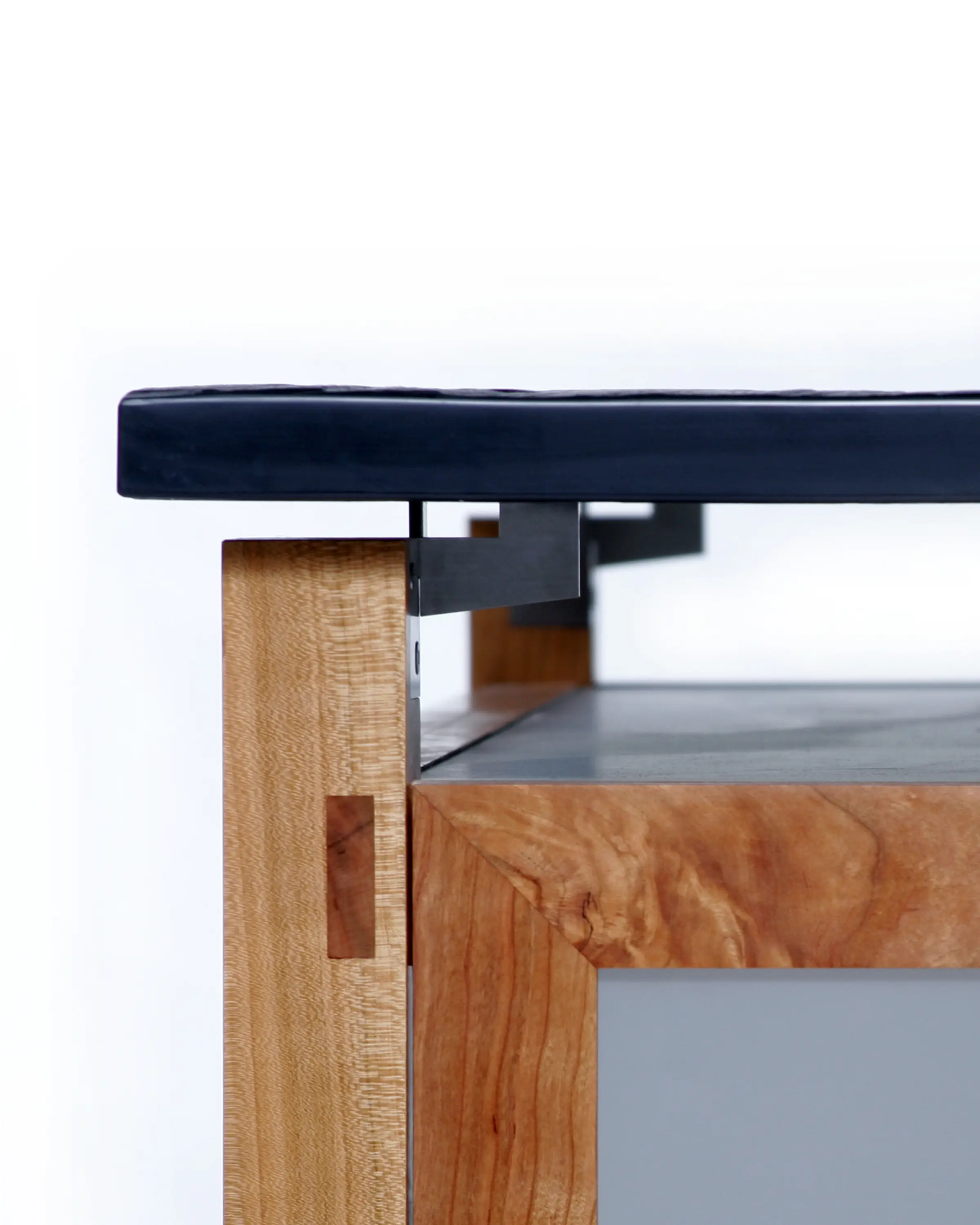 Petrone Console detail showing the relationship between the slate surface and wooden frame