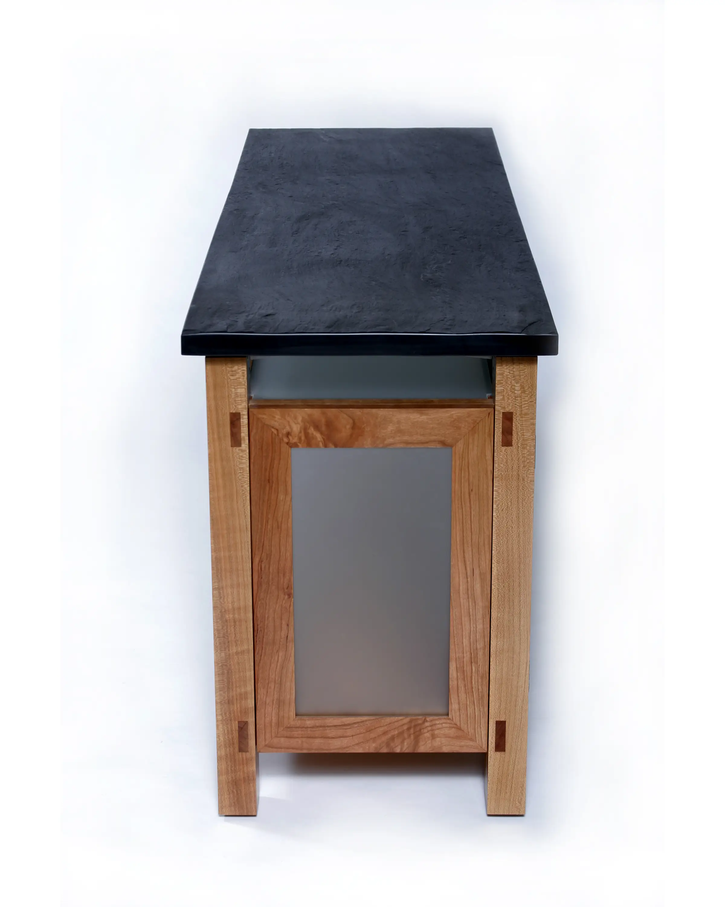 Petrone Console end view highlighting its substantial slate top and cabinet construction