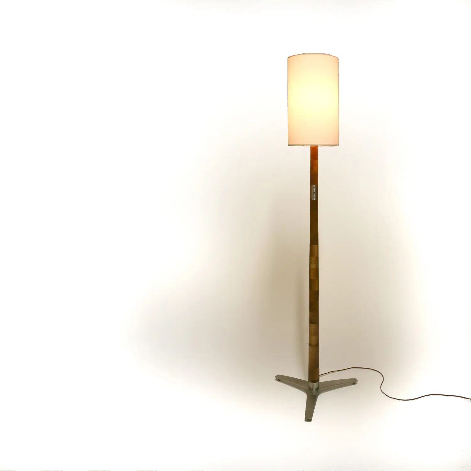 Sharma Lamp illuminated floor lamp with a slender wooden column and cylindrical shade