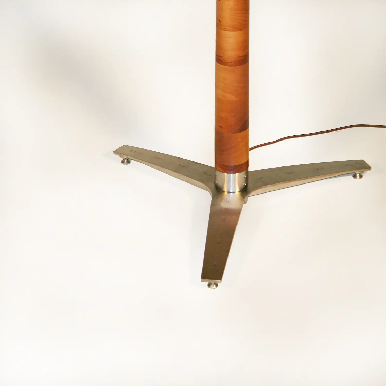Sharma Lamp close-up showing the custom recessed metal switch on its wooden column