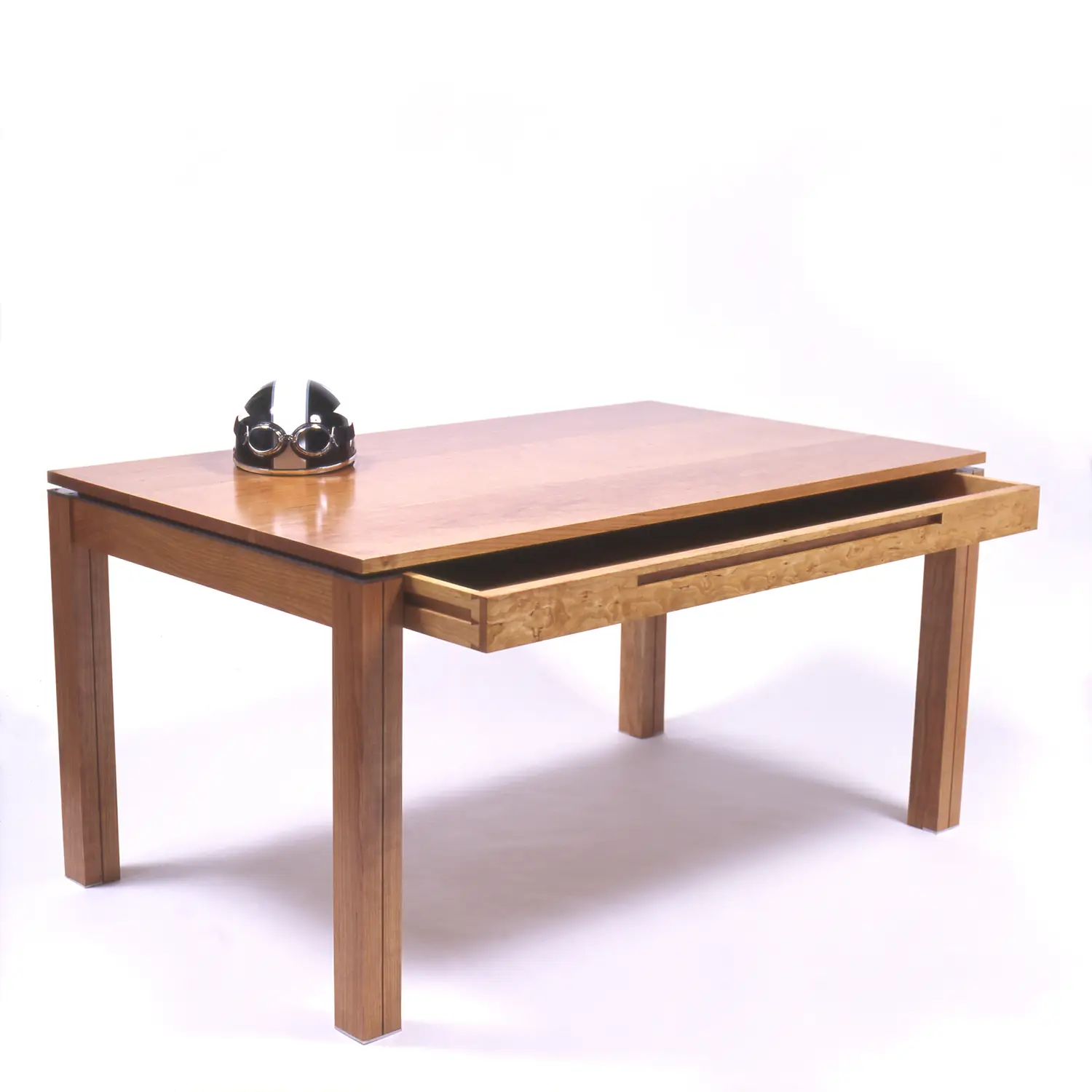 Simple Desk One shown at an angle with its single drawer extended