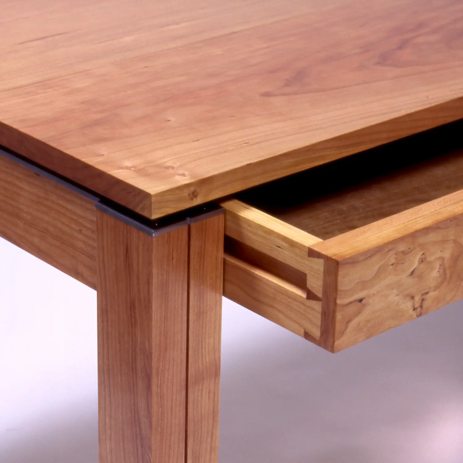 Simple Desk One close-up highlighting the wooden tabletop, drawer construction, and joinery