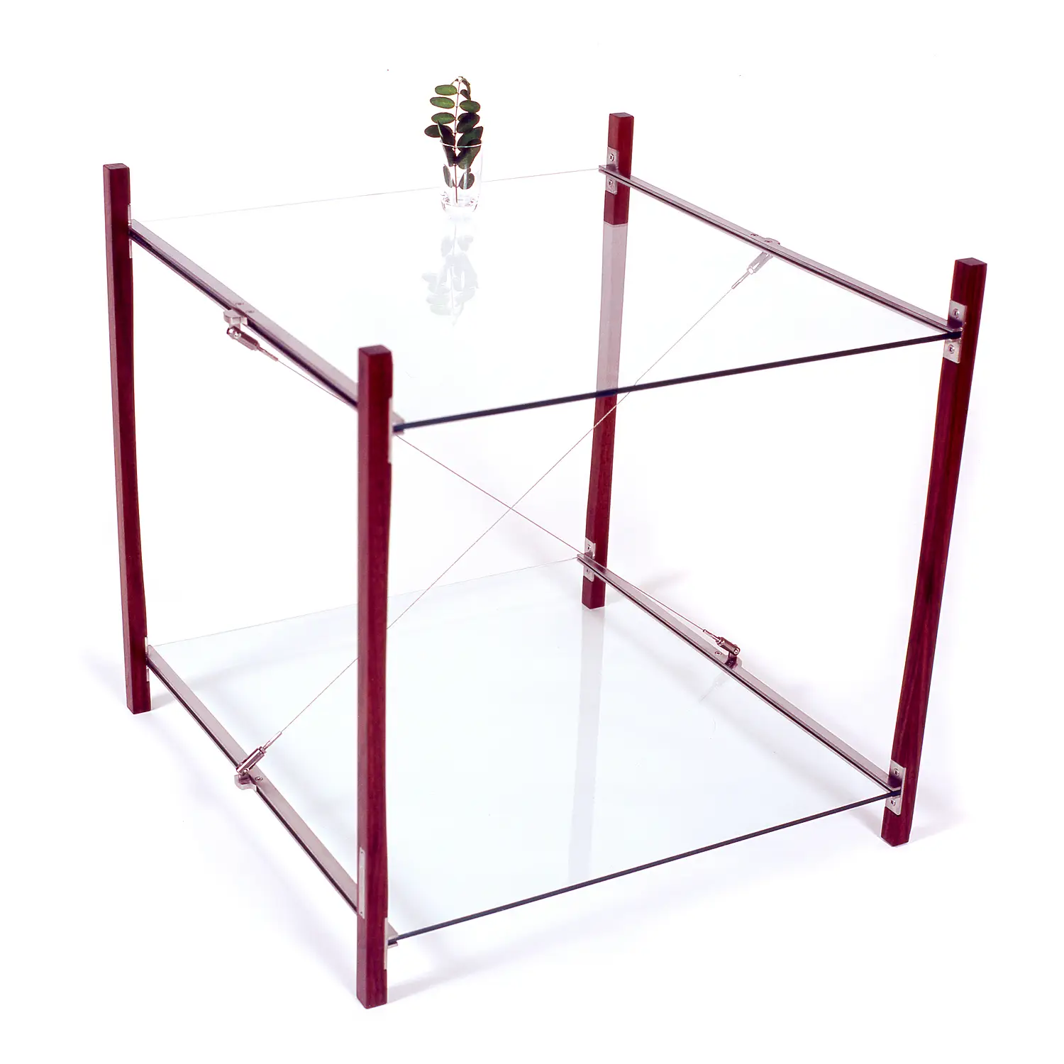 Angled view of the Tension Table revealing its open geometric structure and stainless steel connections.