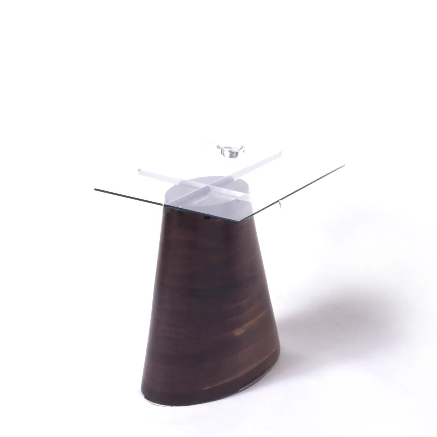 Angled view of the Trunk Table showing its sculptural wooden base and floating glass surface.